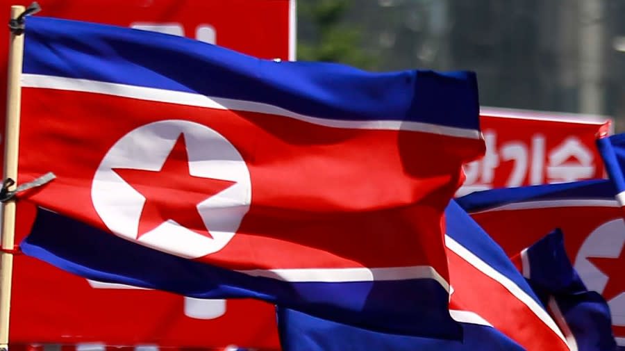 North Korean flags are carried during a celebration of the nation’s 73rd founding anniversary in Pyongyang, North Korea, on Sept. 9, 2021. (Associated Press).