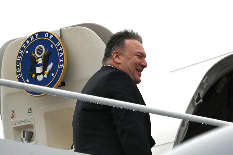 Secretary of State Mike Pompeo, boards a plane as he departs on a multi-country trip, Thursday, Feb. 13, 2020, at Andrews Air Force Base, Md. (Andrew Caballero-Reynolds/Pool via AP)