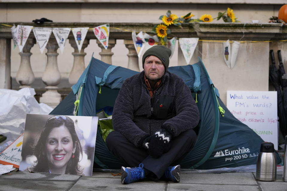 Richard Ratcliffe, the husband of detained charity worker Nazanin Zaghari-Ratcliffe, continues with his hunger strike outside the Foreign, Commonwealth and Development Office in London, Tuesday Nov. 9, 2021. Ratcliffe began his hunger strike after a court decided his wife has to spend another year in an Iranian prison, she has already been detained for more than five years in Iran. (AP Photo/Frank Augstein)