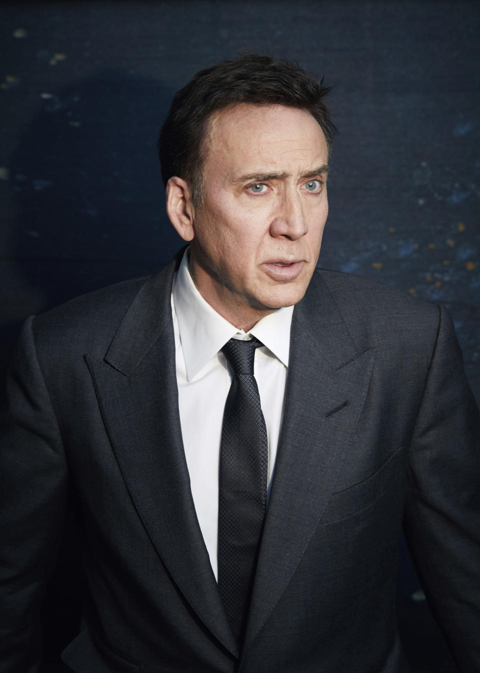 Nicolas Cage poses for a portrait to promote "The Unbearable Weight of Massive Talent" in New York on April 9, 2022. (Photo by Taylor Jewell/Invision/AP)