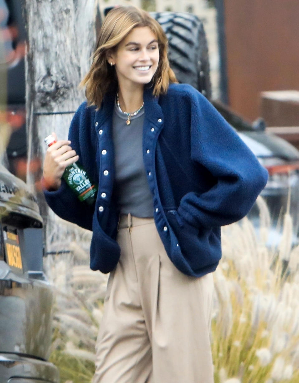 <p>Kaia Gerber wears khakis and a blue coat while out in West Hollywood on Thursday.</p>