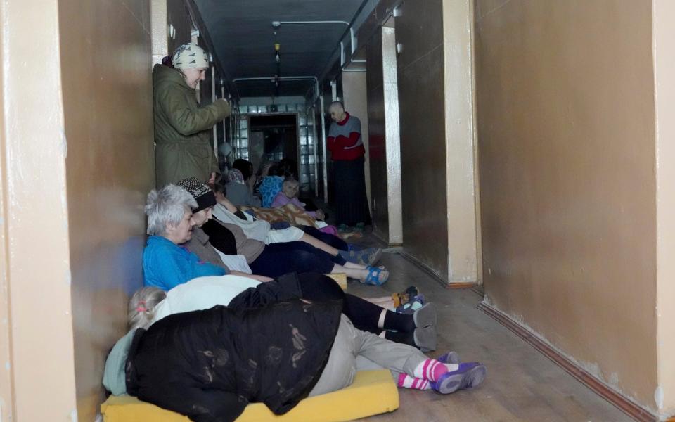 Patients take cover after a Russian attack on a hospital in Kharkiv, Ukraine, Saturday, April 27, 2024.