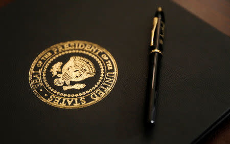 The proclamation to be signed by U.S. President Donald Trump, announcing that the United States recognizes Jerusalem as the capital of Israel and will move its embassy there, sits upon a table before Trump's address at the White House in Washington, U.S., December 6, 2017. REUTERS/Kevin Lamarque