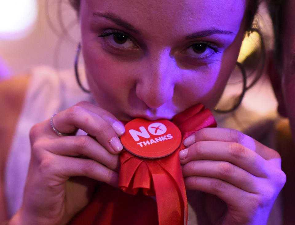 A supporter from the "No" Campaign celebrates at the Better Together Campaign headquarters in Glasgow, Scotland