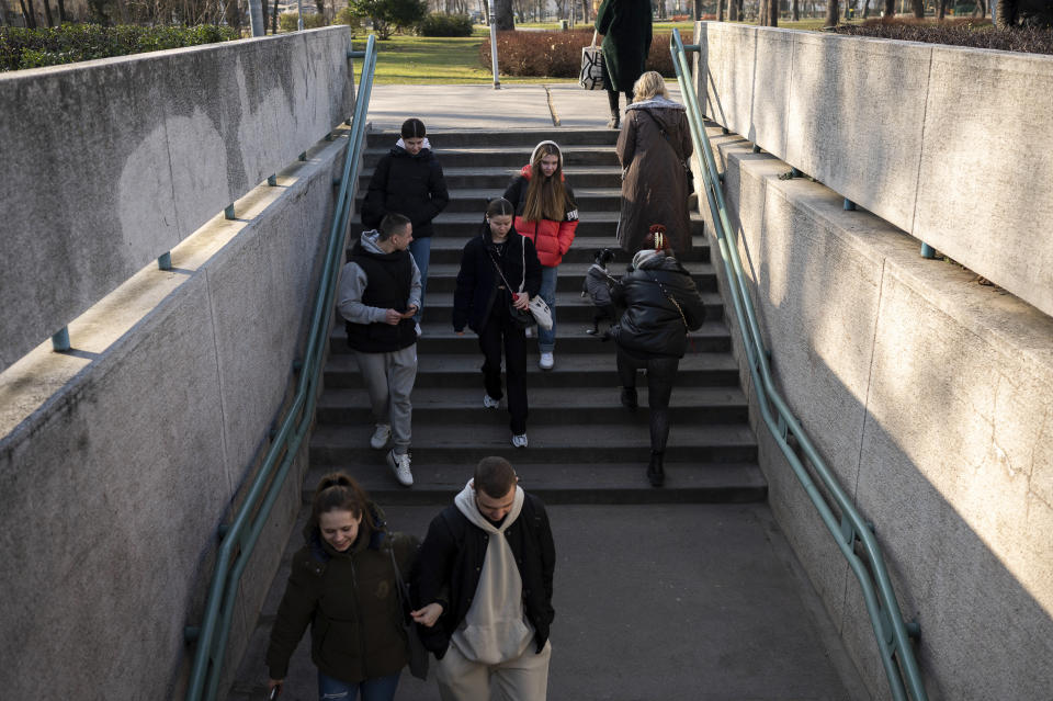 A group of young Ukrainian refugee circus students walking towards their training facility in Budapest, Hungary, Monday, Feb. 13, 2023. More than 100 Ukrainian refugee circus students, between the ages of 5 and 20, found a home with the Capital Circus of Budapest after escaping the embattled cities of Kharkiv and Kyiv amid Russian bombings. (AP Photo/Denes Erdos)