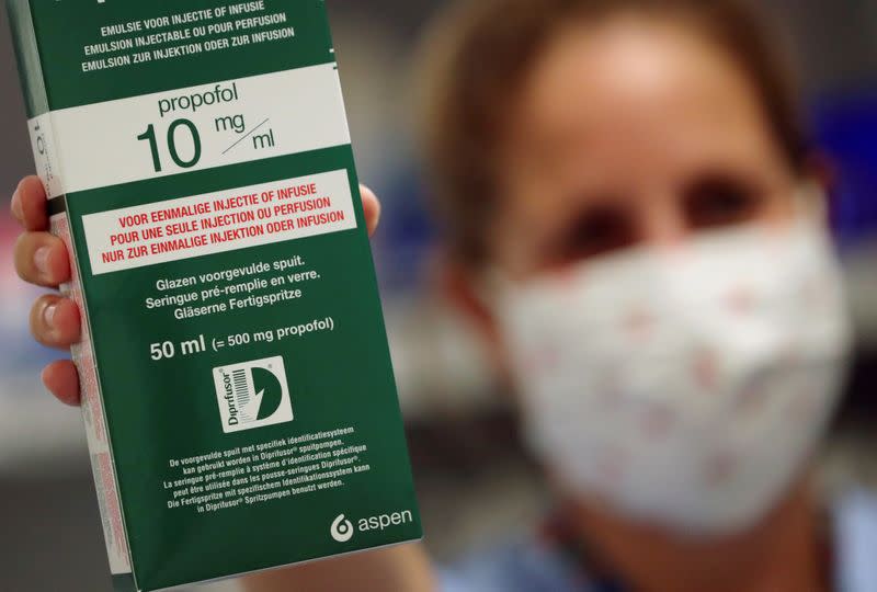 A worker of the pharmacy shows a box of an anaesthetic, amid the coronavirus disease (COVID-19) outbreak, in Brussels