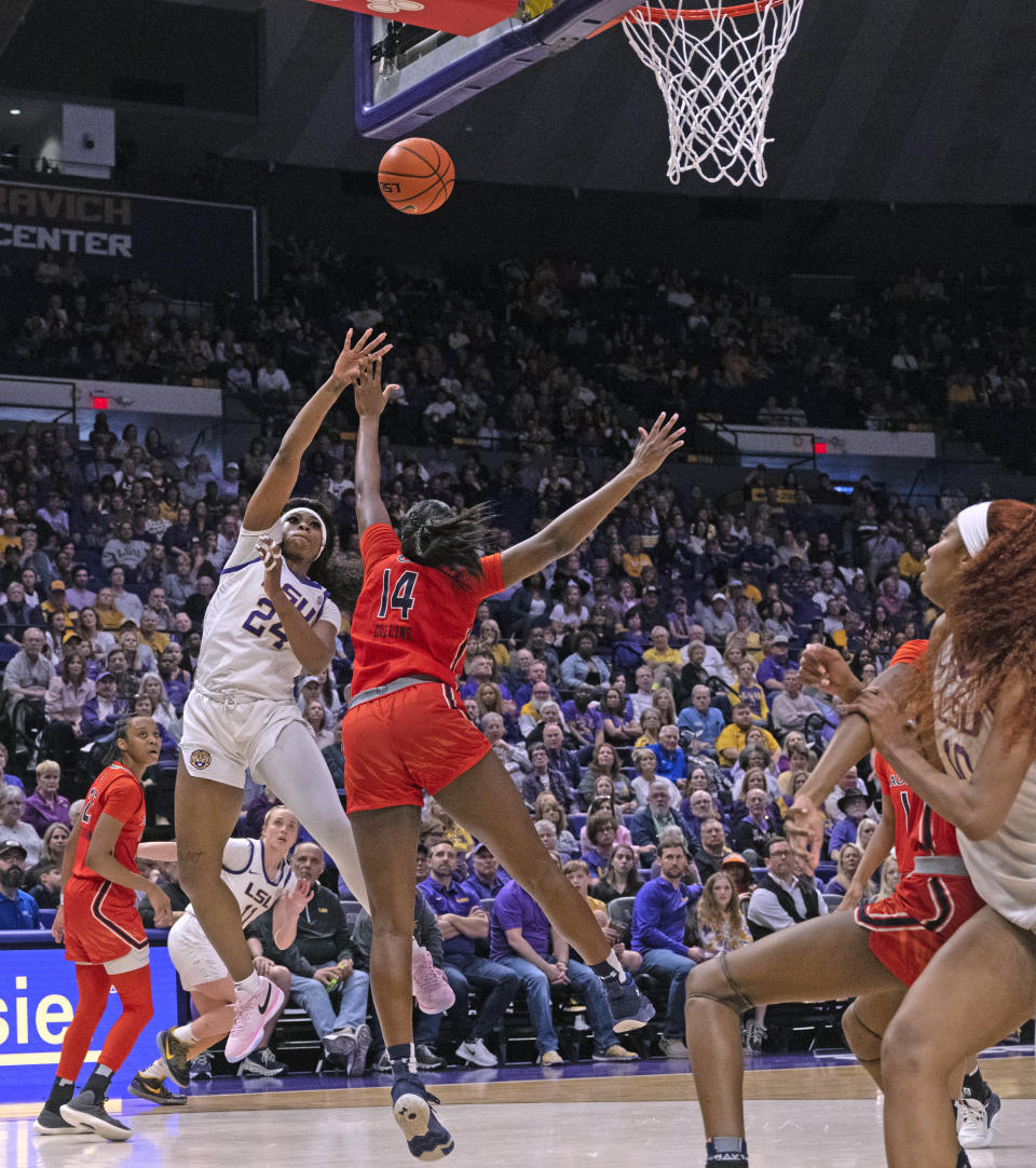 LSU guard Aneesah Morrow (24) shoots as Auburn forward Taylen Collins (14) defends during an NCAA college basketball game Thursday, Feb. 22, 2024, in Baton Rouge, La. (Hilary Scheinuk/The Advocate via AP)