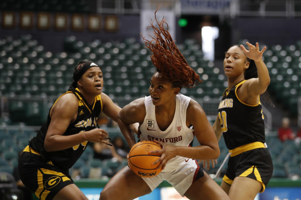 Stanford forward Kiki Iriafen goes for the net between Grambling State center Amanda Blake and forward Cierra Christian during the first quarter of an NCAA college basketball game, Saturday, Nov. 26, 2022, in Honolulu. (AP Photo/Marco Garcia)