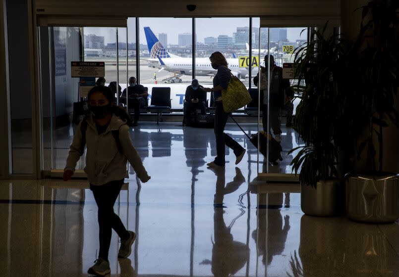 Los Angeles, CA - May 28: Amid a busy getaway travel day for the Memorial Day weekend and the first holiday since coronavirus pandemic restrictions have been relaxed, travelers make their way to their destinations at LAX, United Airlines, Terminal 7 in Los Angeles Friday, May 28, 2021. Officials say travelers should arrive early for Memorial Day weekend flights. After months of Los Angeles International Airport looking like a ghost town, holiday crowds are back. "We're seeing more travelers than we've seen in the last 14 months. We had over 75,000 people come through on Sunday alone to the TSA checkpoints, that's by far a record in 2021 for us," said LAX spokesperson Keith Montgomery. Photo taken in LAX on Friday, May 28, 2021 in Los Angeles, CA. (Allen J. Schaben / Los Angeles Times)