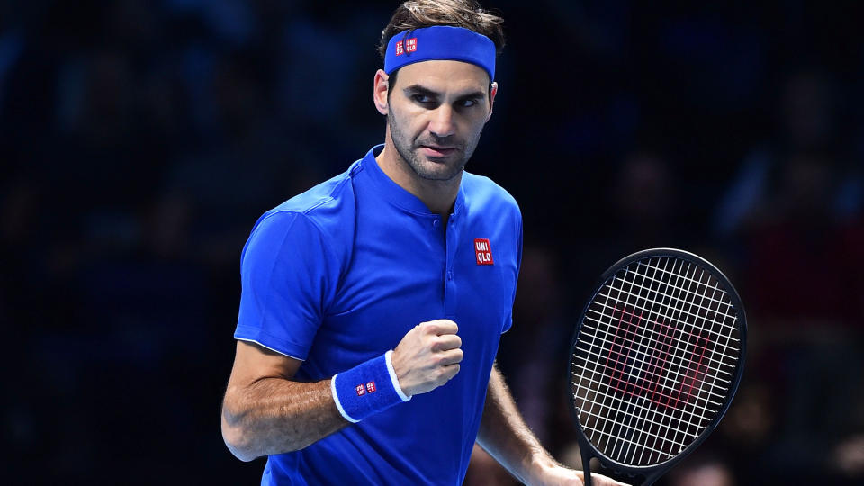 Roger Federer celebrates. (Photo by GLYN KIRK/AFP/Getty Images)