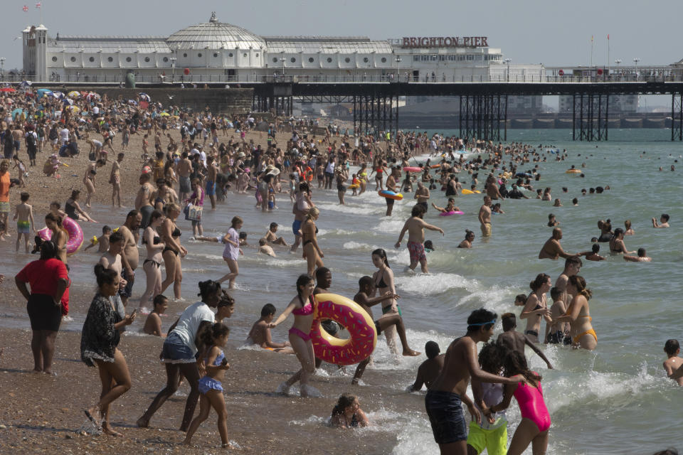 BRIGHTON, ENGLAND - JULY 31: Members of the public enjoy the sunshine on Brighton Beach on July 31, 2020 in Brighton, England. High temperatures are forecast across the UK today, with some areas in the south expected to reach 33-34C. (Photo by Dan Kitwood/Getty Images)