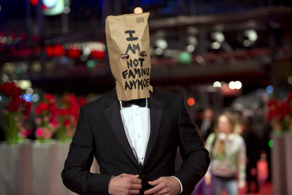 Actor Shia LaBeouf poses for photographers, with a paper bag over his head that says 'I am not famous anymore', on the red carpet for the film Nymphomaniac at the International Film Festival Berlinale in Berlin, Sunday, Feb. 9, 2014. (AP Photo/Axel Schmidt)
