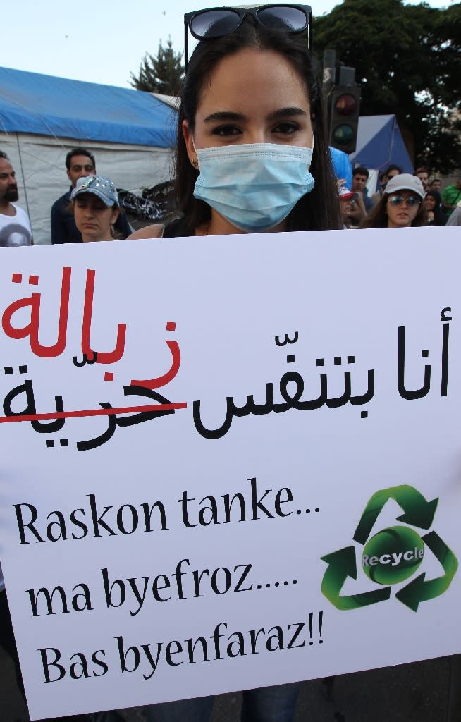 "I breathe garbage", the placard reads, at a demonstration by local residents in Beirut on July 25, 2015, over a landfill site the government had pledged to close down (AFP Photo/Anwar Amro)