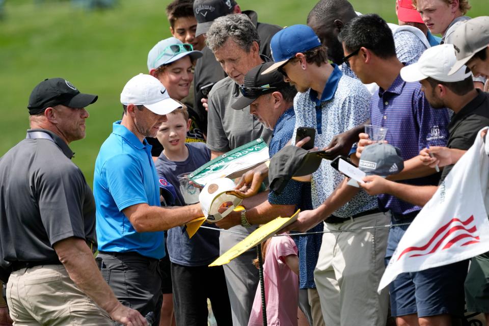 Jun 4, 2024; Columbus, Ohio, USA; Rory McIlroy signs autographs during a practice round for the Memorial Tournament at Muirfield Village Golf Club.