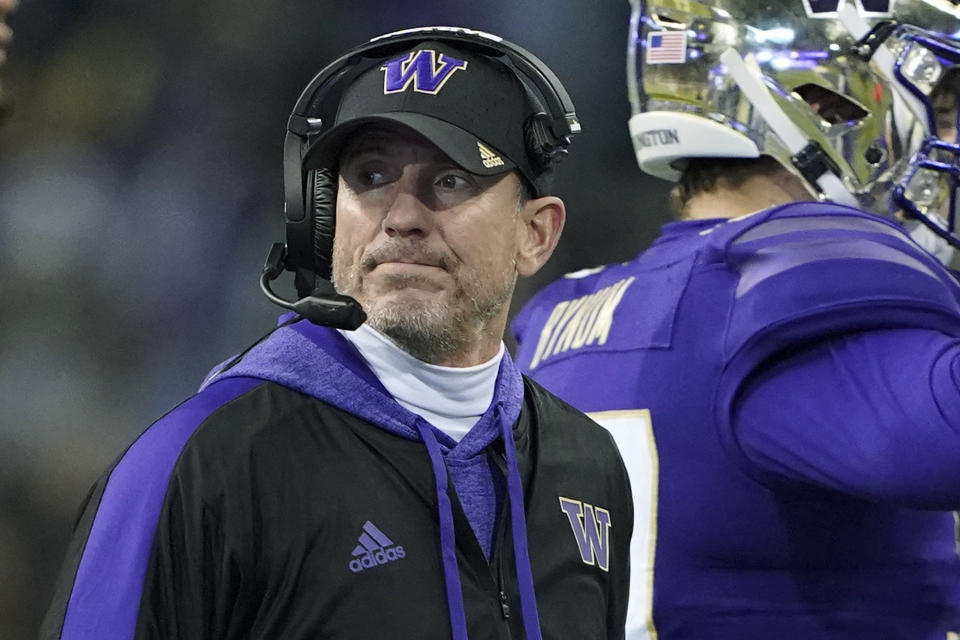 Washington interim head coach Bob Gregory looks toward the field after a time out during the second half of an NCAA college football game against Washington State, Friday, Nov. 26, 2021, in Seattle. (AP Photo/Ted S. Warren)