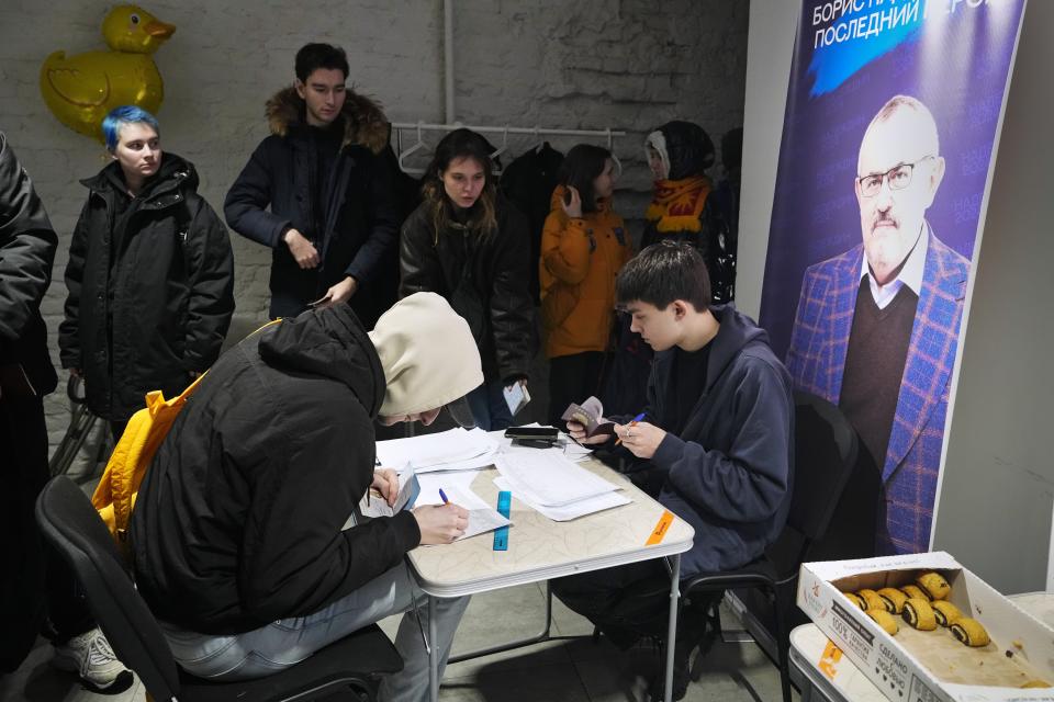 People sign petitions in St. Petersburg, Russia, on Tuesday, Jan. 23, 2024, for Boris Nadezhdin, a liberal Russian politician who is seeking to run in the March 17 presidential election. Supporters lined up not just in progressive cities like Moscow and St. Petersburg but also in Krasnodar in the south, Saratov and Voronezh in the southwest and beyond the Ural Mountains in Yekaterinburg. There also were queues in the Far East city of Yakutsk, 450 kilometers (280 miles) south of the Arctic Circle, where Nadezhdin's team said up to 400 people a day braved temperatures that plunged to about minus 40 Celsius (minus 40 Fahrenheit) to sign petitions. (AP Photo/Dmitri Lovetsky, File)