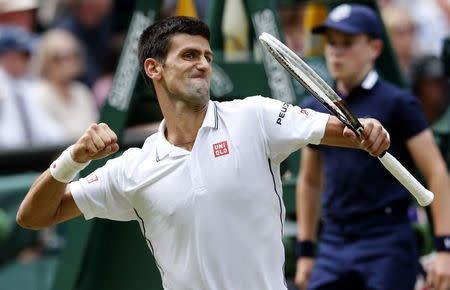 Novak Djokovic of Serbia reacts to winning the second set during his men's singles final tennis match against Roger Federer of Switzerland at the Wimbledon Tennis Championships, in London July 6, 2014. REUTERS/Suzanne Plunkett