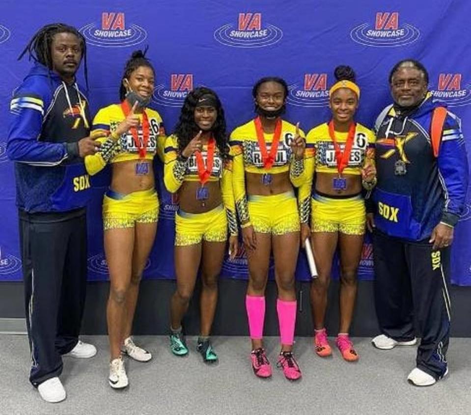 Track standouts Alyssa Jones, Somiyah Braggs, Meara Rasul, and Cynteria James of the record setting girls’ 4x200 relay team with their South Dade Express coaches Barry Cooper and Gene Mason. 