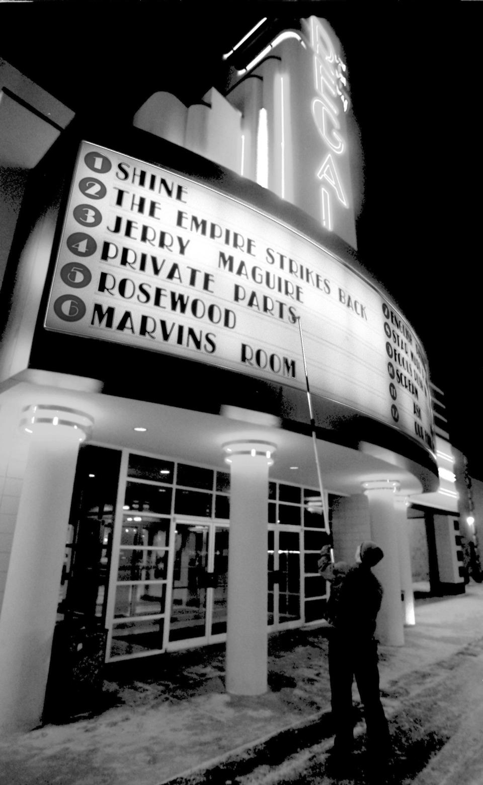 NOW PRIVATE CARDEW 3-7-97 Steve Biggins of Regal  Cinema in Montrose puts up the sign for "Private Parts" the movie based on the book by Howard Stern. Photo by Mike Cardew