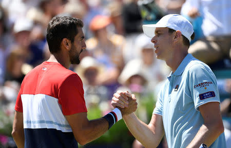 Tennis - ATP 500 - Fever-Tree Championships - The Queen's Club, London, Britain - June 22, 2018 Croatia's Marin Cilic shakes hands with Sam Querrey of the U.S. after winning their quarter final match Action Images via Reuters/Tony O'Brien