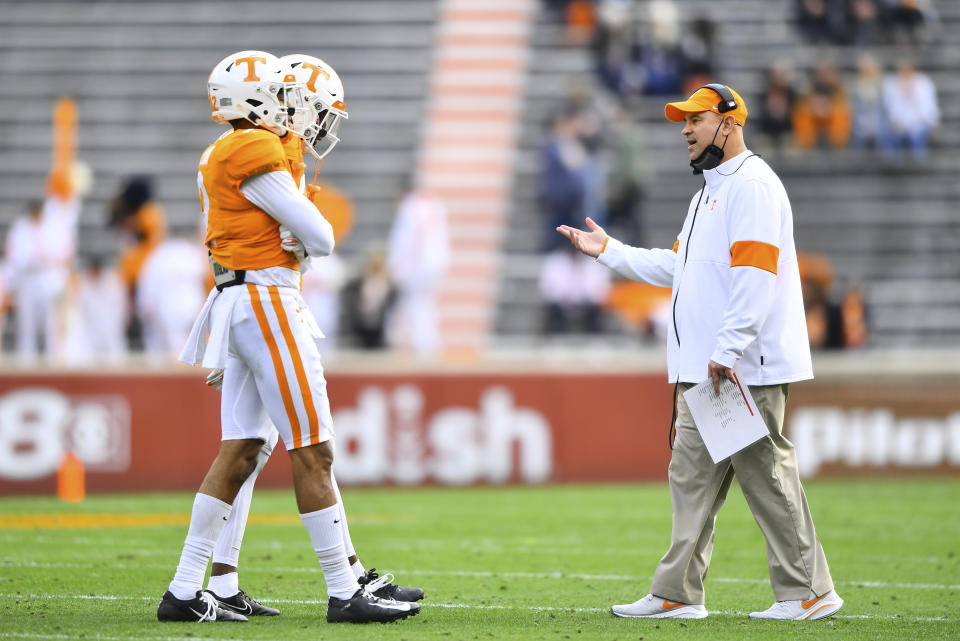 Tennessee head coach Jeremy Pruitt walks onto the field to talk to players during an NCAA college football game against Texas A&M in Neyland Stadium in Knoxville, Tenn., Saturday, Dec. 19, 2020. (Brianna Paciorka/Knoxville News Sentinel via AP, Pool)