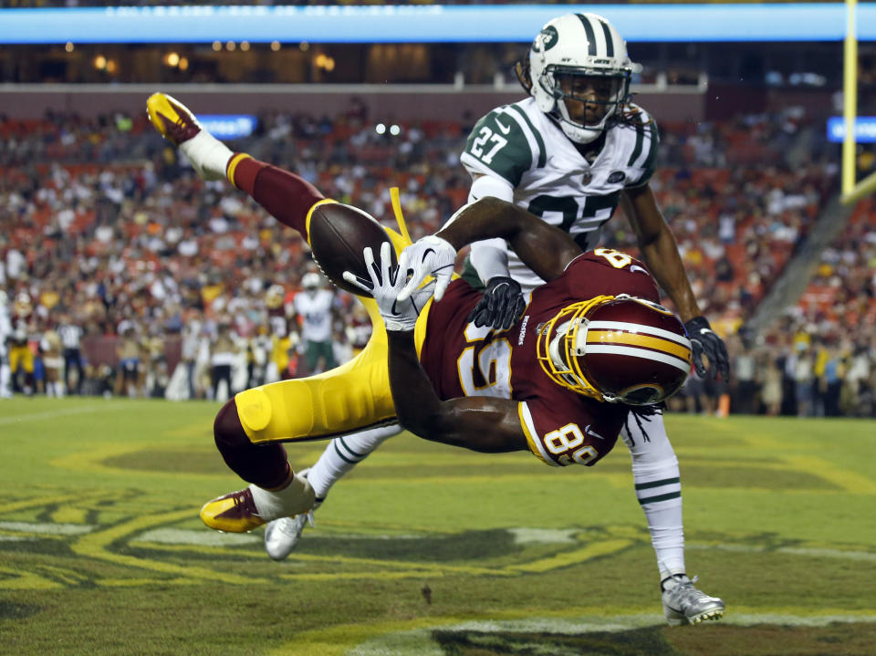 New York Jets cornerback Darryl Roberts (27) breaks up a pass intended for Washington Redskins wide receiver Cam Sims (89) during the first half of a preseason NFL football game Thursday, Aug. 16, 2018, in Landover, Md. (AP Photo/Alex Brandon)