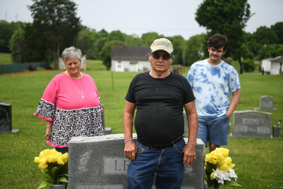 Ricky Lewis' father, R.B. Lewis (center), stands alongside Linda White (left), Ricky's aunt, and his grandson, Jason Hoover (right), ahead of a balloon release honoring Ricky at Strawberry Plains Cemetery on May 26.