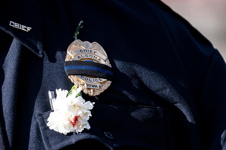 Algona Police Chief Bo Miller delivers a statement outside the funeral for Algona Police Department Officer Kevin Cram at the Algona Community School on Wednesday, September 20, 2023 in Algona.