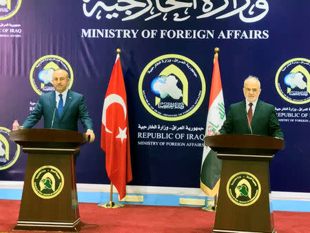 Turkish foreign minister Mevlut Cavusoglu speaks during a joint news conference with Iraqi Foreign Minister Ibrahim al-Jaafari in Baghdad, Iraq August 23, 2017. REUTERS/Khalid al Mousily