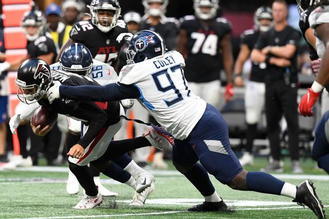 Tennessee Titans defensive tackle Trevon Coley (97) leaves the turf after  an injury against the Atlanta Falcons during the first half of a preseason  NFL football game, Friday, Aug. 13, 2021, in