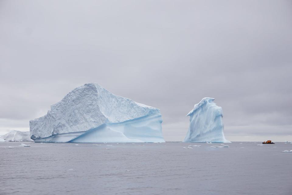 kayak near pieces of antarctic iceberg