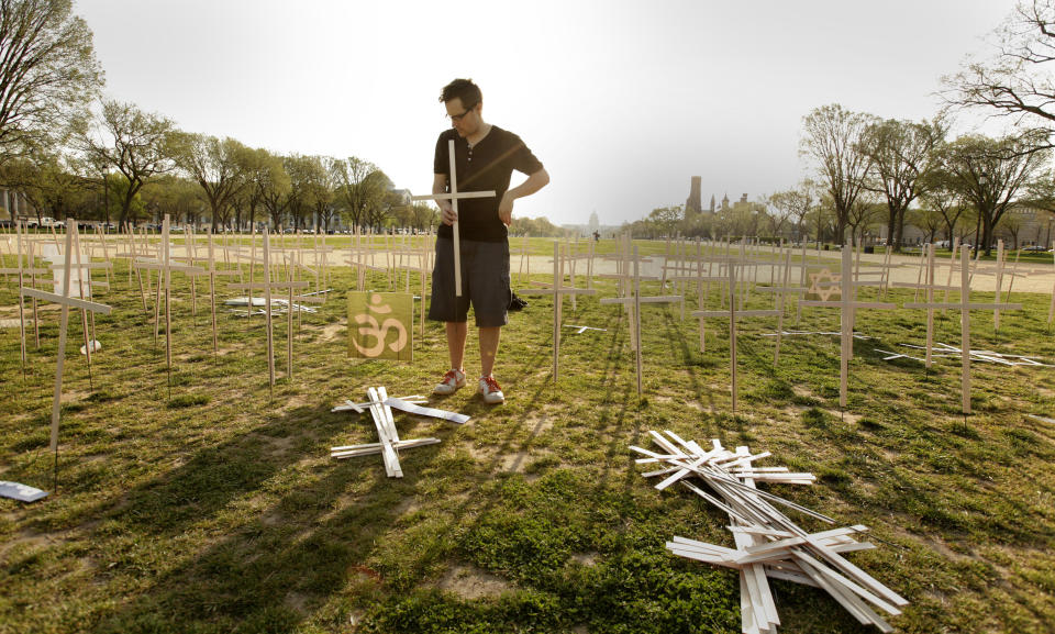 Volunteers set up 3,300 grave markers representing gun violence deaths since Newtown 