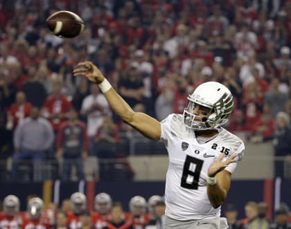 Oregon&#39;s Marcus Mariota throws during the first half of the NCAA college football playoff championship game against Ohio State Monday, Jan. 12, 2015, in Arlington, Texas. (AP Photo/David J. Phillip)