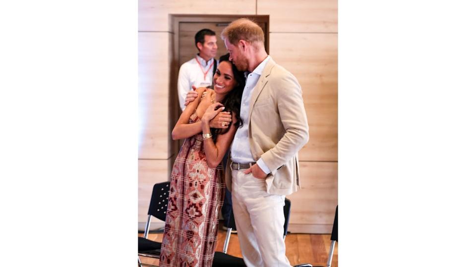 Harry kisses Meghan's head