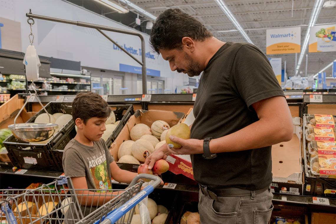 Lemar and a son buy groceries at the local Walmart in Joplin, Missouri.