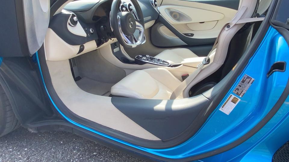 The McLaren GT's carbon fiber structure reduces the size of door openings for entry and exit.