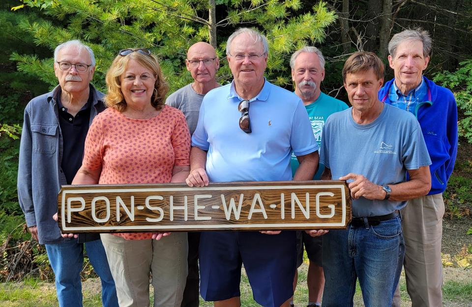 Ponshewaing flag stop project volunteers include (front row, from left) Carol Crow, Randall Crow, Wayne Blomberg, (back row) BR Smith, Mark Grace, Scott Smith, and Rick Newman.