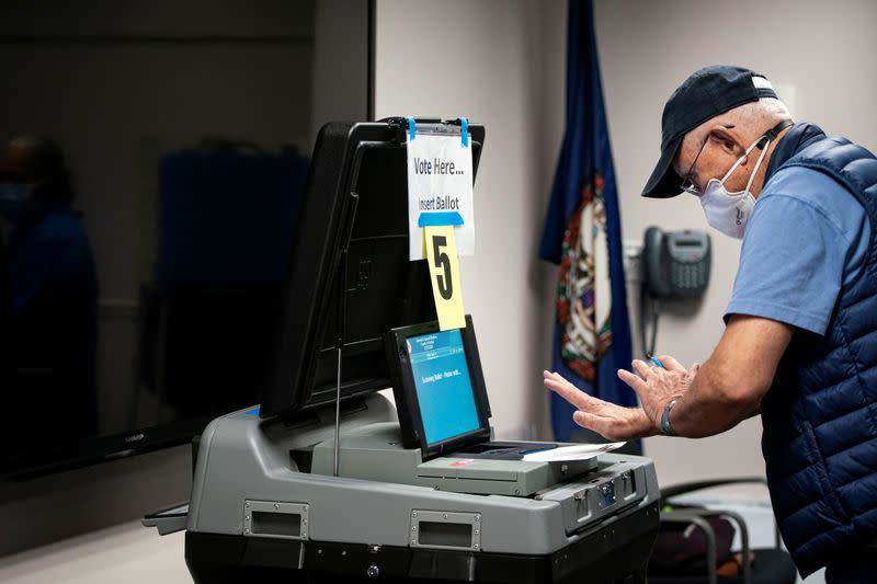 FILE PHOTO: People vote at an early voting site in Fairfax, Virginia