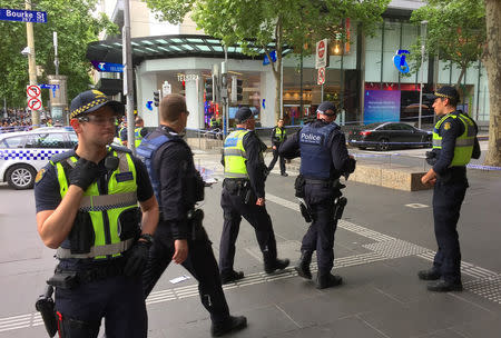 Policemen stop members of the public from walking towards the Bourke Street mall in central Melbourne, Australia, November 9, 2018. REUTERS/Sonali Paul