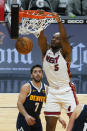 Miami Heat forward Precious Achiuwa (5) dunks the ball over Denver Nuggets guard Facundo Campazzo (7) during the second half of an NBA basketball game, Wednesday, Jan. 27, 2021, in Miami. (AP Photo/Marta Lavandier)