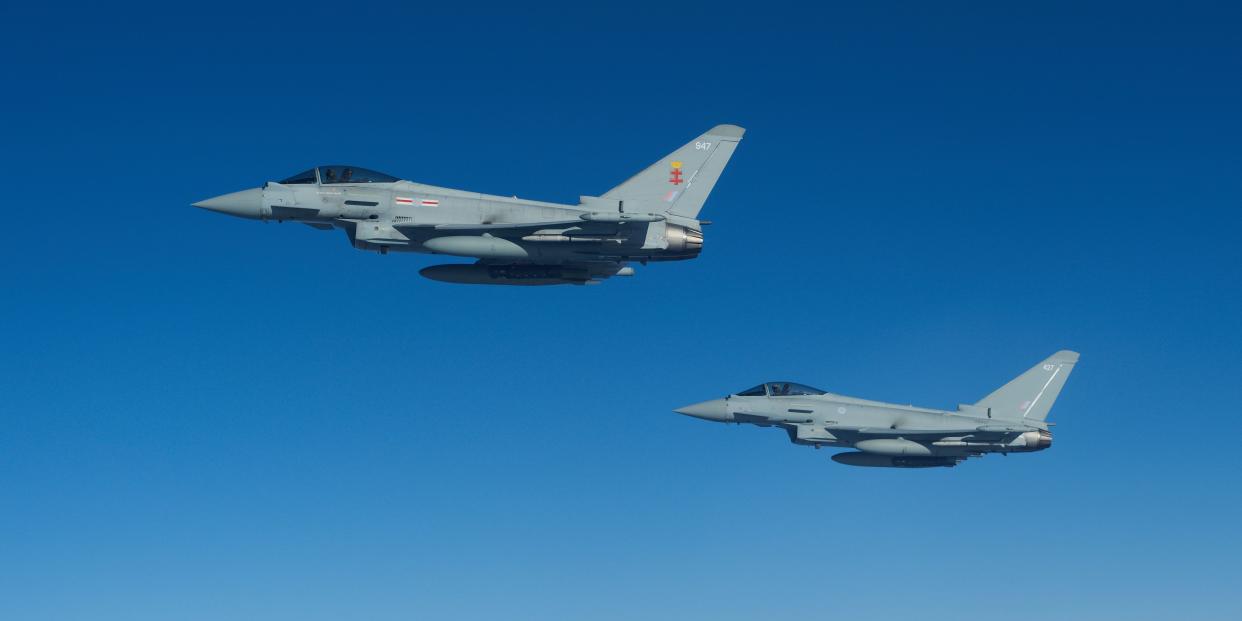 Two RAF Typhoon combat aircraft depart after refueling from an RAF Voyager aircraft over the North Sea on October 08, 2020 in flight, above Scotland.