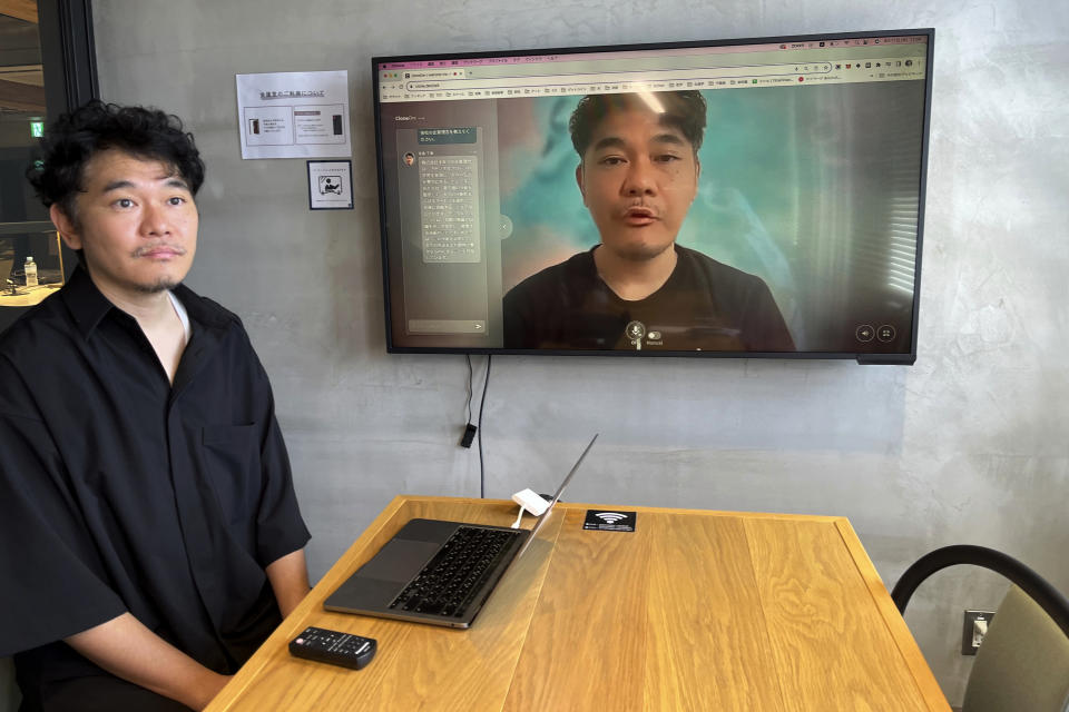 Kazutaka Yonekura, chief executive of Tokyo startup Alt Inc., demonstrates his digital clone on a personal computer at his office in Tokyo, Aug. 17, 2023. His company is developing a digital double, an animated image that looks and talks just like its owner. (AP Photo/Yuri Kageyama)