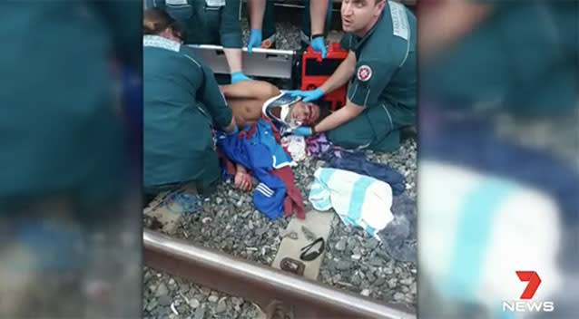 Aung Su was looking at his phone when he was hit by a train. Source: 7 News