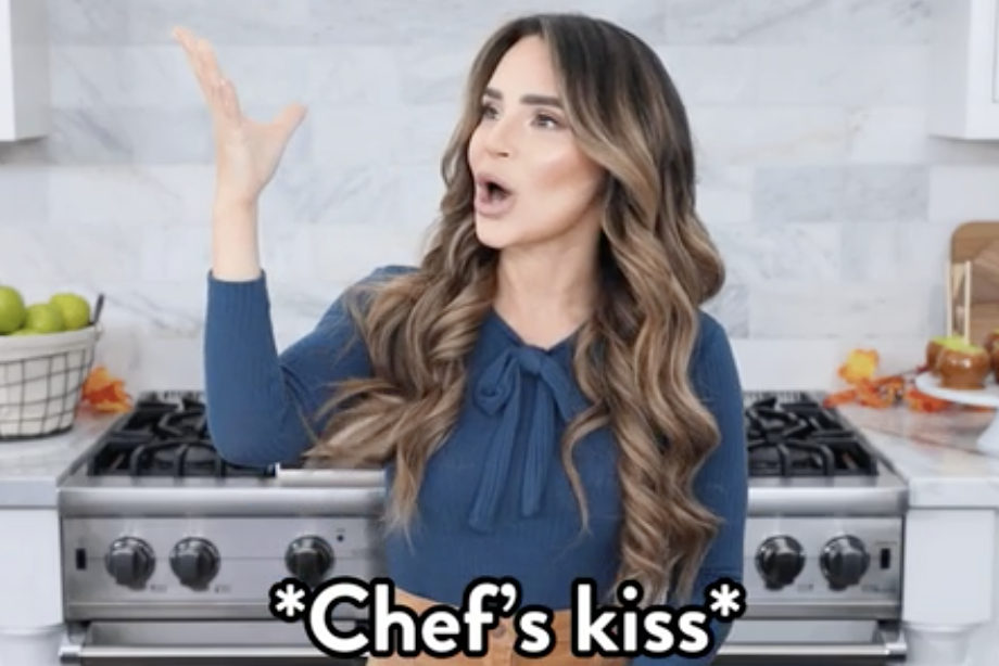 a woman saying "chef's kiss"