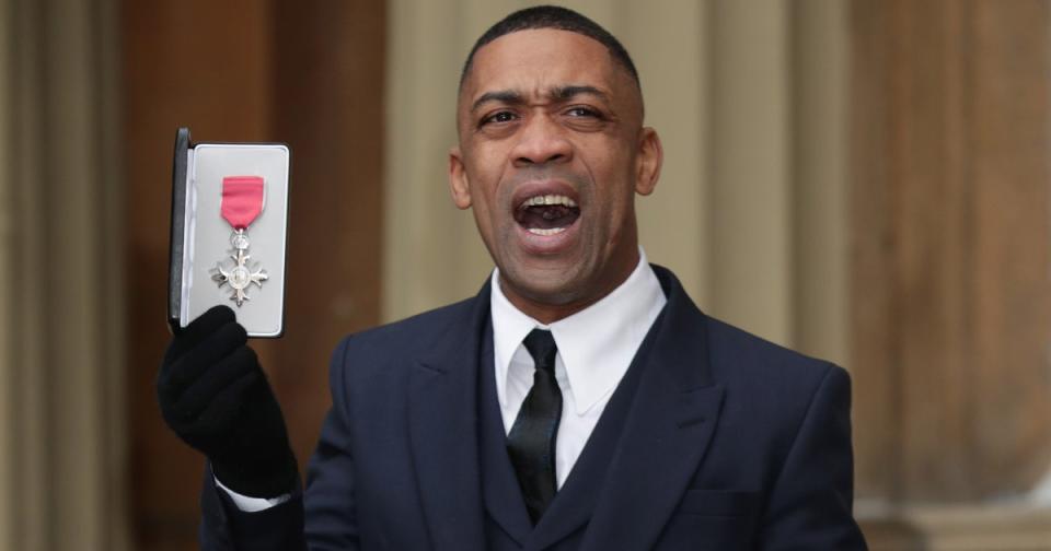 Wiley holding his MBE in 2017 (PA)