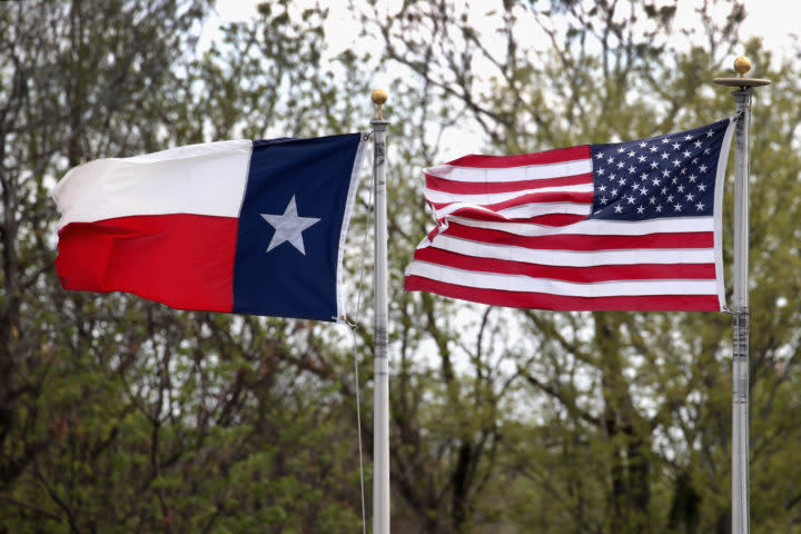 Texas flag next to the American flag