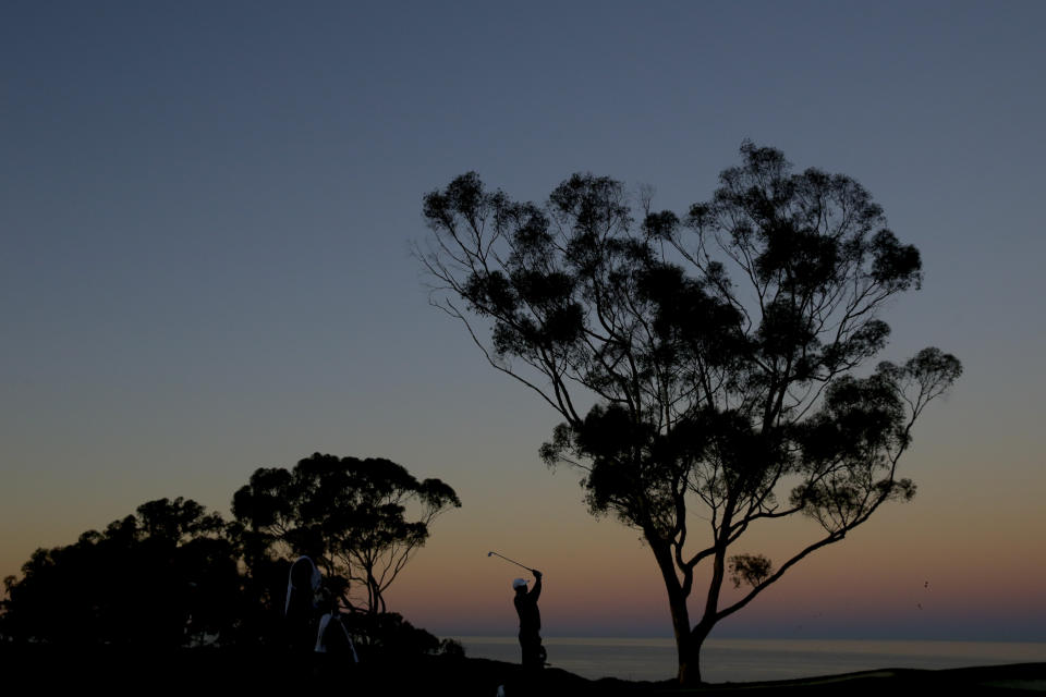 Tiger Woods hits from the fairway on the first hole during the pro-am round of the Farmer's Insurance Open golf tournament on the North Course at Torrey Pines Golf Course on Wednesday, Jan. 23, 2019, in San Diego, Calif. (AP Photo/Chris Carlson)