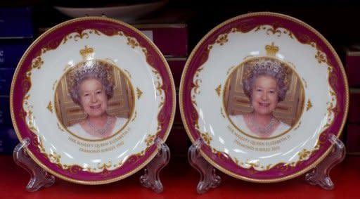 Souvenir plates commemorating Queen Elizabeth II's diamond jubilee are on sale in a London shop. The Centre for Retail Research predicts that consumers will spend Â£307 million this summer on jubilee and Olympic souvenirs