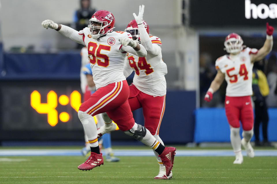 Kansas City Chiefs defensive tackle Chris Jones, left, celebrates with teammates after sacking Los Angeles Chargers quarterback Easton Stick during the second half of an NFL football game, Sunday, Jan. 7, 2024, in Inglewood, Calif. The sack earned Jones a $1.25 million contract incentive. (AP Photo/Ashley Landis)