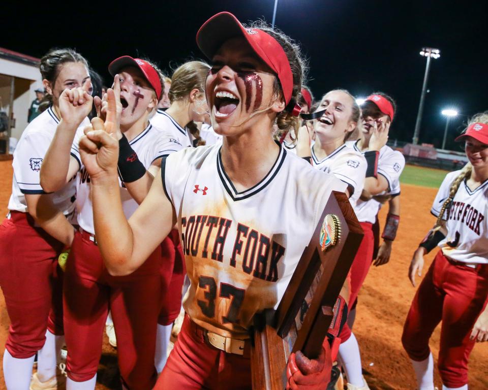 South Fork's Ashley Anderson (37) celebrates with her team after winning the District 8-5A softball championship 3-0 against Okeechobee Thursday, May 5, 2022, at South Fork High School in Martin County.